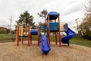Elkridge apartment for rent - a playground with a blue slide and a red slide at Lawyers Hill Apartments, Elkridge, MD