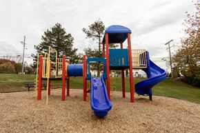 Elkridge apartment for rent - a playground with a blue slide and a red slide at Lawyers Hill Apartments, Elkridge, MD