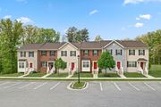 Baltimore apartment for rent - Apartment building with a parking lot in front.