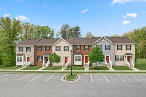 Baltimore apartment for rent - Apartment building with a parking lot in front.