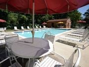 Towson apartment for rent - a swimming pool with a table and chairs