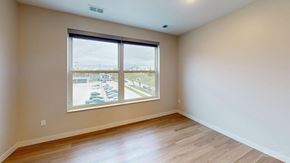 Grand Forks apartment for rent - A room with a large window overlooking a parking lot.