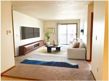 Grand Forks apartment for rent - a living room with a couch and a coffee table