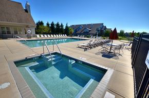 New Berlin apartment for rent - a swimming pool with lounge chairs and a spa