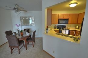 Waukesha apartment for rent - a view of a kitchen and a dining room with a table