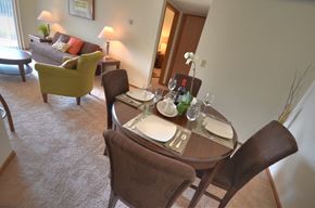 Waukesha apartment for rent - a dining room with a table and chairs in a hotel room