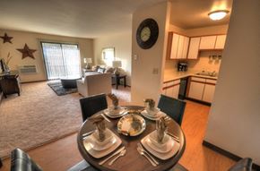 Waukesha apartment for rent - an open living room with a dining room table and a kitchen