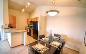 New Berlin apartment for rent - a dining room and kitchen with a table and chairs