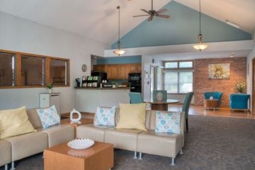 New Berlin apartment for rent - a living room and dining room with a couch and a table