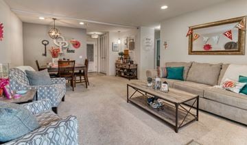 Middleton apartment for rent - a living room with couches and chairs and a table