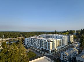 Shoreline apartment for rent - The exterior of the building with scenic views at Verdant Apartments in Shoreline.
