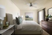 Cerritos apartment for rent - Bedroom with ceiling fan and carpeted flooring at Cerritos Apartments