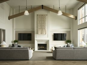 Englewood apartment for rent - A modern living room with vaulted ceilings and a fireplace at The Sophia in Englewood.