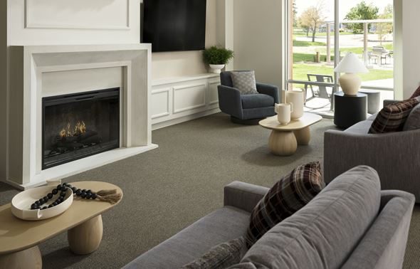 Englewood apartment for rent - A cozy, spacious living room with a fireplace at The Sophia in Englewood.