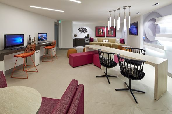Alhambra apartment for rent - A modern living room with a television and a bar area.
