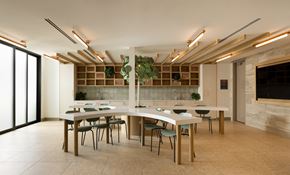 Cypress apartment for rent - a craftroom with a long white table and chairs