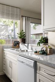 Cerritos apartment for rent - Kitchen with whirlpool appliances and white shaker cabinetry at Cerritos Apartments
