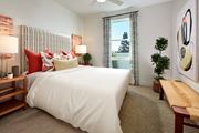 Northridge apartment for rent - Modern style model bedroom with a window at Symmetry apartments in Northridge.