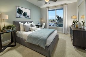 Alhambra apartment for rent - A bedroom with a large bed and a painting on the wall.