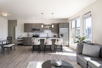 Englewood apartment for rent - A modern kitchen with a dining table and chairs.