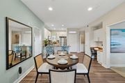 Dublin apartment for rent - A dining room with a table set for four at Park Sierra at Iron Horse Trail in Dublin.