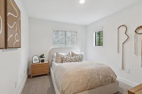 San Jose apartment for rent - A model unit bedroom with a queen size bed and natural lighting at Elan at River Oaks in San Jose.