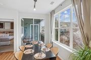 Highlands Ranch apartment for rent - A dining room with a table set for six with a view of the backyard.