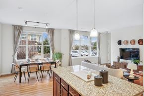 Highlands Ranch apartment for rent - A kitchen with a table and chairs in front of a window.
