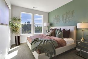Denver apartment for rent - Bedroom with carpet and big picture windows at The York on City Park in Denver