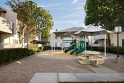 Cerritos apartment for rent - Playground area and picnic tables at Cerritos Apartments