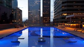 Denver apartment for rent - Luxurious outdoor swimming pool amenity with a view at The Quincy in Downtown Denver.