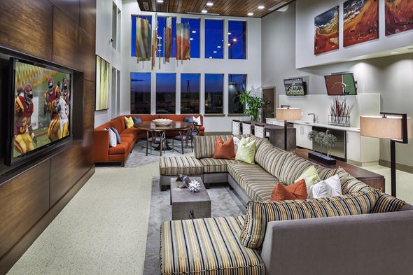 Highlands Ranch apartment for rent - A living room with a grey couch and a coffee table.