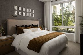 Cypress apartment for rent - a bedroom with a large bed and a large window