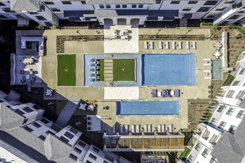 Grand pool courtyard with large resort-style swimming pool and plunge pool