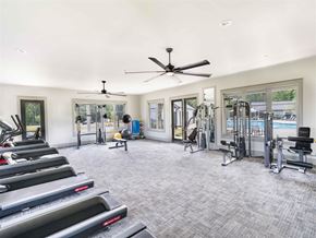Hoschton apartment for rent - a gym with treadmills and a ceiling fan