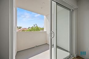 Los Angeles apartment for rent - a balcony with a view of a blue sky and a window