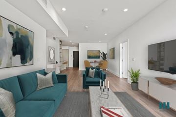 Los Angeles apartment for rent - a living room with a blue couch and a table and chairs