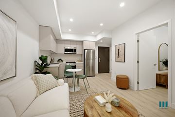 Los Angeles apartment for rent - A modern living room with a white sofa and a wooden coffee table.