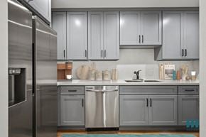 Los Angeles apartment for rent - a kitchen with gray cabinets and stainless steel appliances