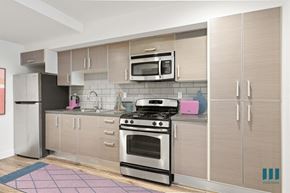 Los Angeles apartment for rent - Open-Concept Kitchen with Stainless-Steel Refrigerator, Stove, and Microwave Oven