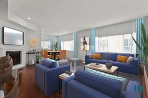 Los Angeles apartment for rent - A living room with blue couches and a fireplace.