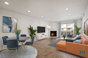 Los Angeles apartment for rent - a living room with a couch and a table and a fireplace
