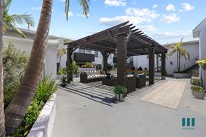 Los Angeles apartment for rent - a patio with a pergola and couches