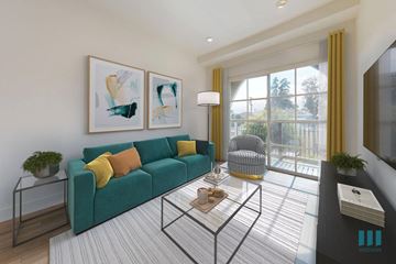 Los Angeles apartment for rent - a living room with a green couch and a glass coffee table
