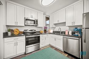 Los Angeles apartment for rent - A kitchen with white cabinets and stainless steel appliances.