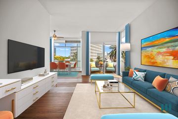 Los Angeles apartment for rent - A living room with a blue couch and a television.