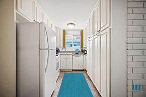 Los Angeles apartment for rent - A kitchen with white cabinets and a white fridge.