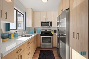 Los Angeles apartment for rent - a modern kitchen with stainless steel appliances and white cabinets