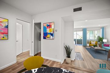 Los Angeles apartment for rent - A living room with a yellow chair and a painting on the wall.