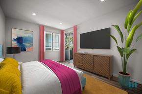 Los Angeles apartment for rent - A bedroom with a large bed and a flat screen TV mounted on the wall.